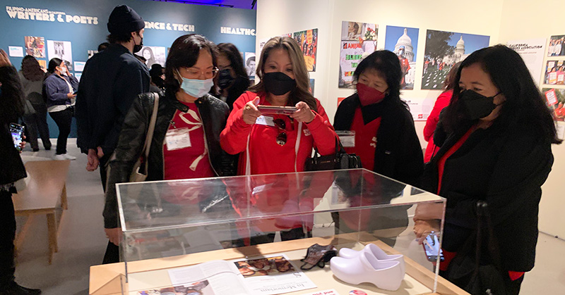 Group of nurses looking at museum exhibit