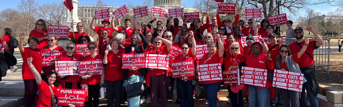 Large group of nurses outside Capitol Building in Washington, D.C, holding signs "Some Cuts Don't Heal" and "Fund Care Not Billionaires"