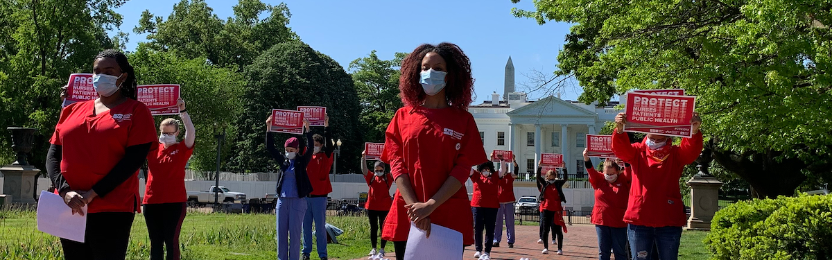 Nurses hold signs "Protect Nurses"