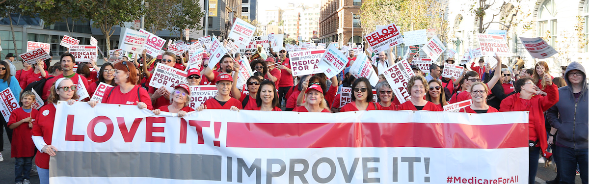 Nurses hold signs "Medicare For All"