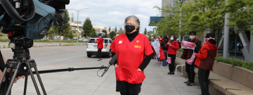 Nurse in front of video cameras