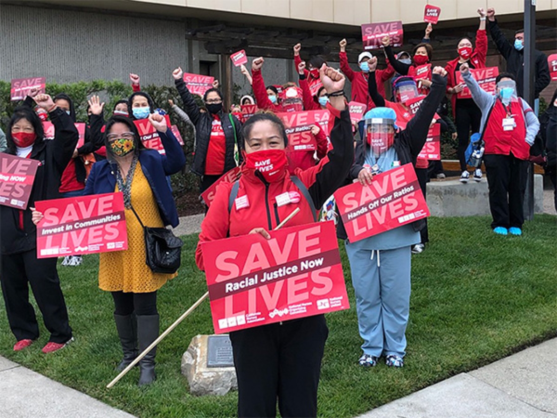 Nurses with raised fists