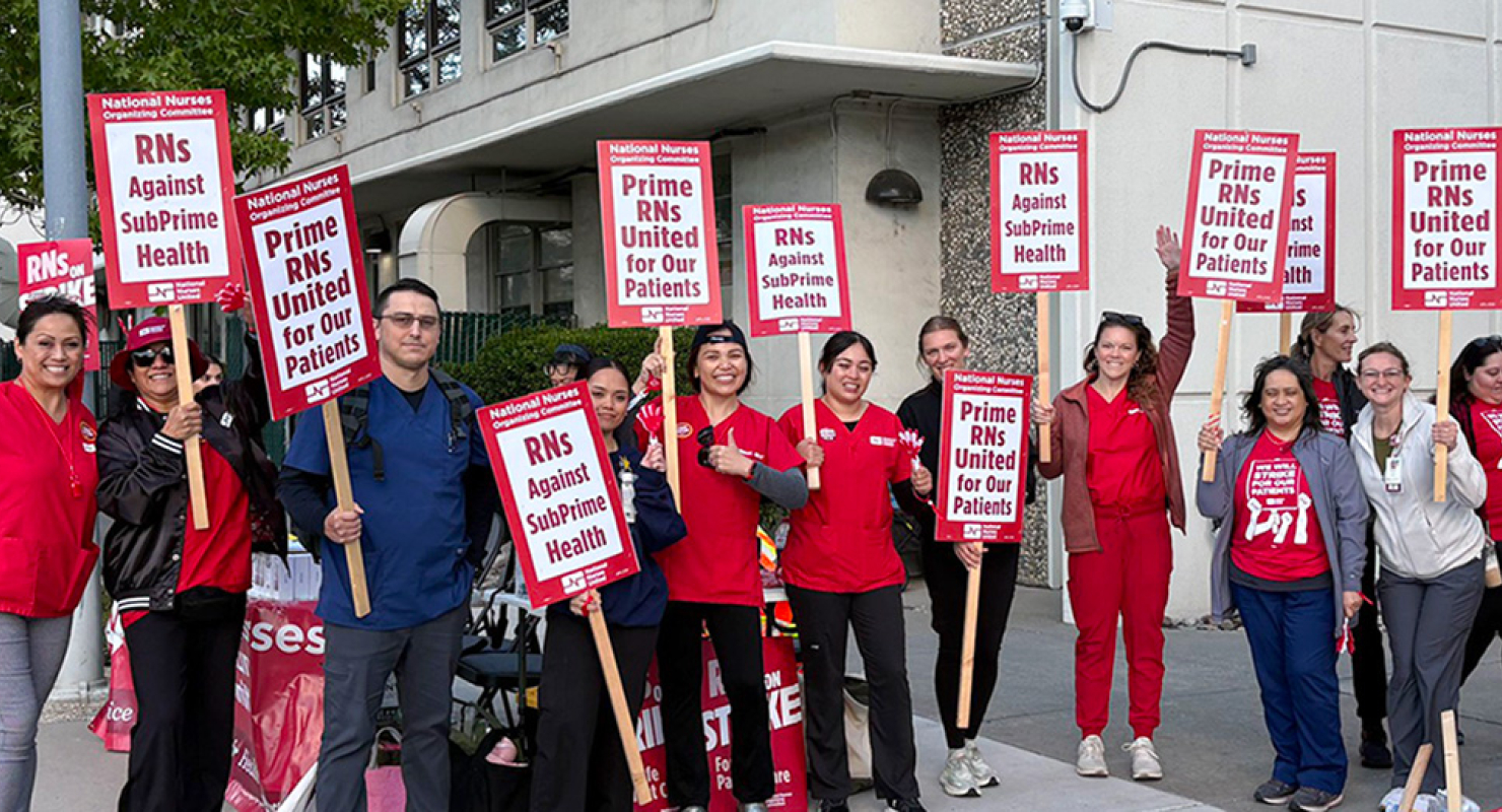 Nurses on strike line holding signs "Prime RNs United for our Patients"