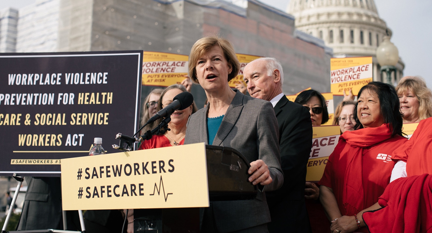 Senator Tammy Baldwin at podium outside Capitol Building