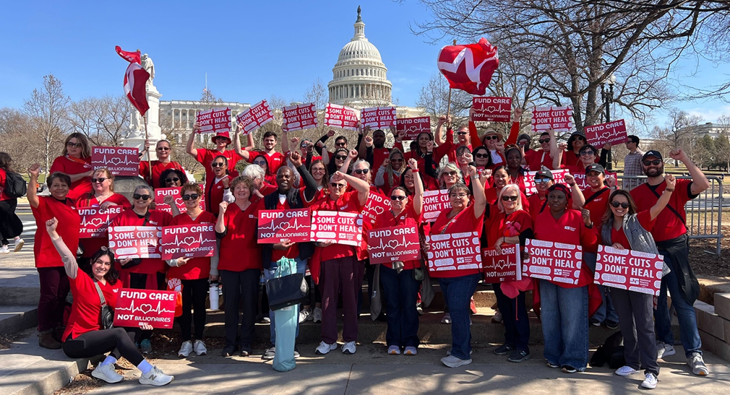 Large group of nurses outside Capitol building in Washington, D.C., holding signs "Fun Care, Not Billionaires" and "Some Cuts Don't Heal"