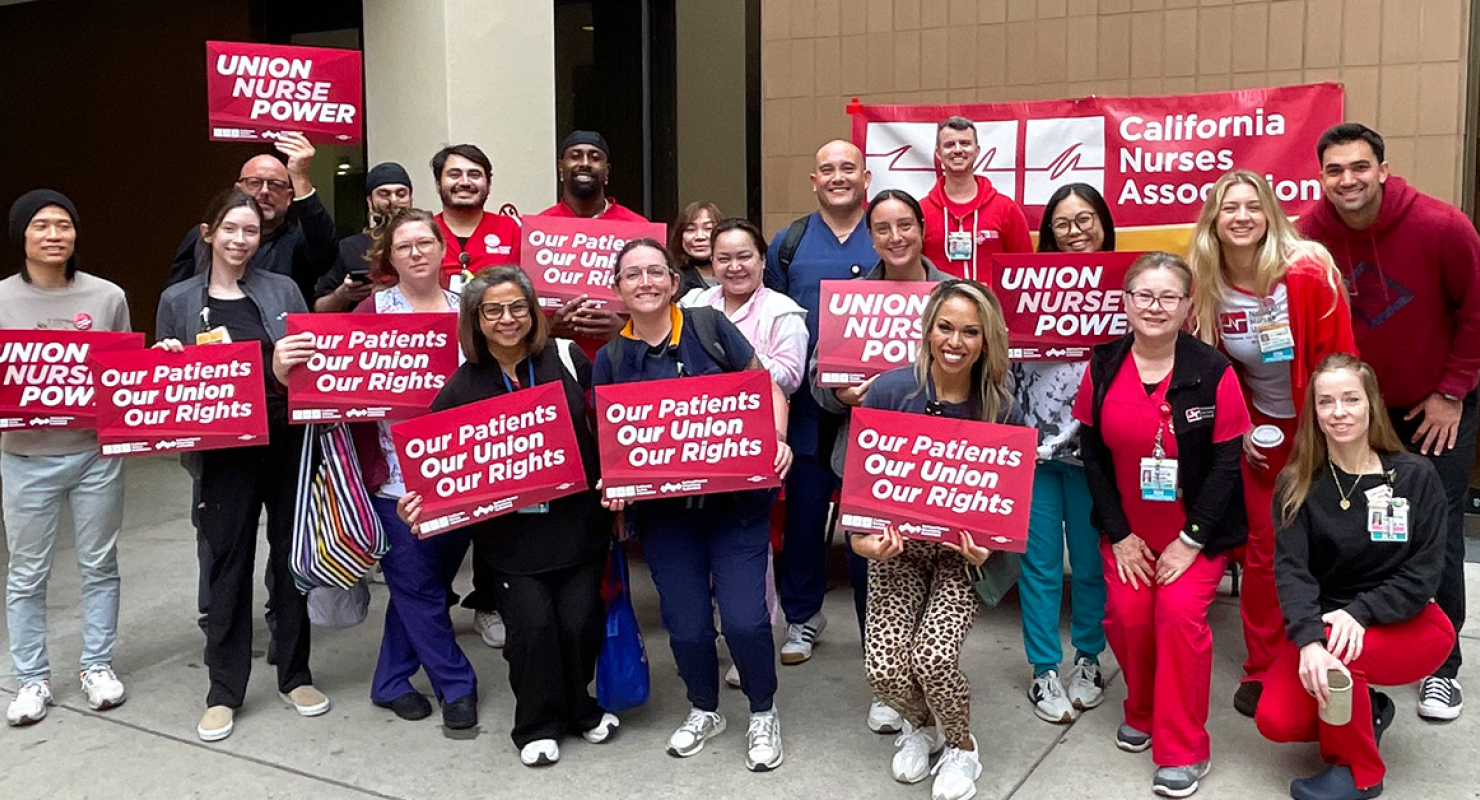 Group of nurses holding signs "Our Patients, Our Union, Our Rights"