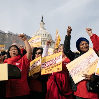 Nurses outside Capitol hold signs "Workplace Violence Puts Everyone at Risk"