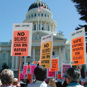 Crowd outside of CA capitol holding signs calling for safe staffing ratios