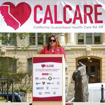 Nurse at podium in front of CalCare banner