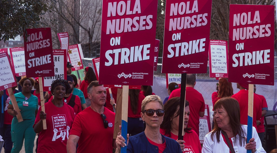 UMC nurses on strike, holding signs that read "NOLA nurses on strike."