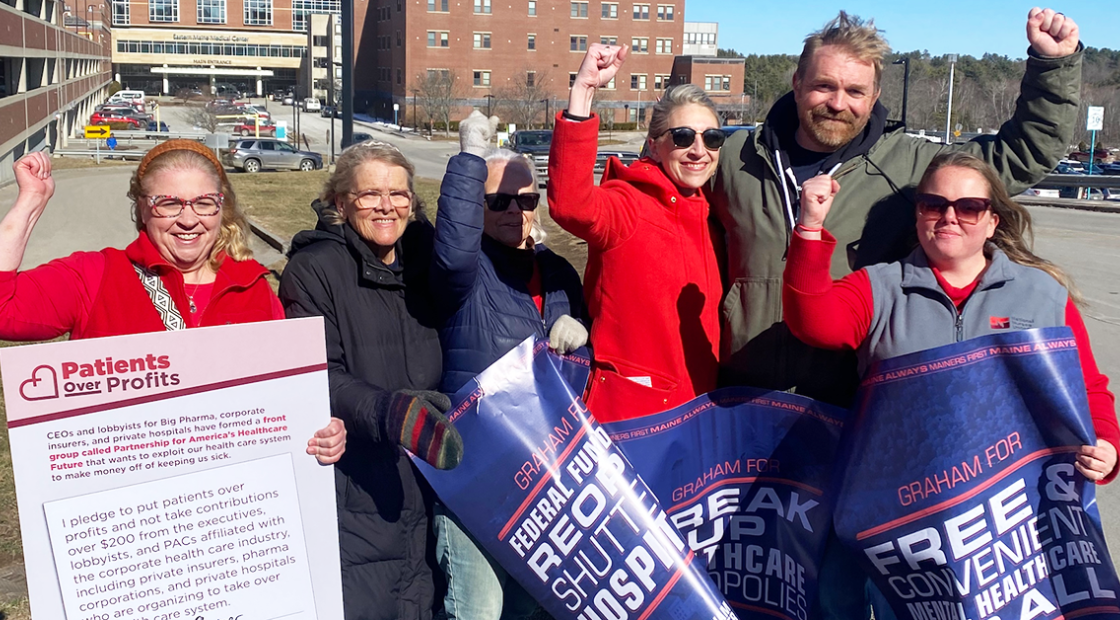 Nurses with Graham Platner, raising fists