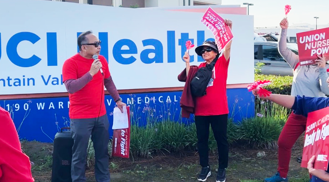 Nurses speaking out in front of UCI Health Fountain Valley sign
