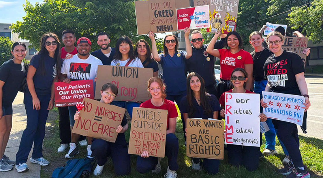 Large group of nurses outside holding signs calling for union rights, patient care, and an end to hospital greed