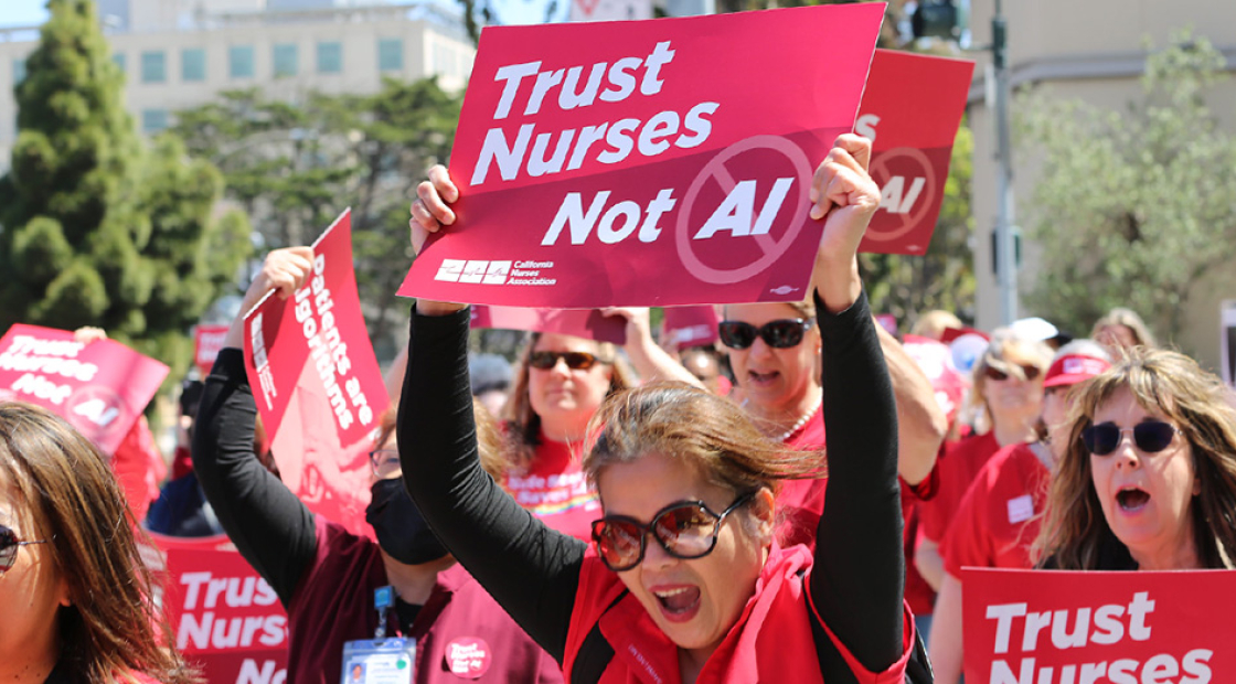 Nurses marching, holding signs "Trust Nurses Not A.I."