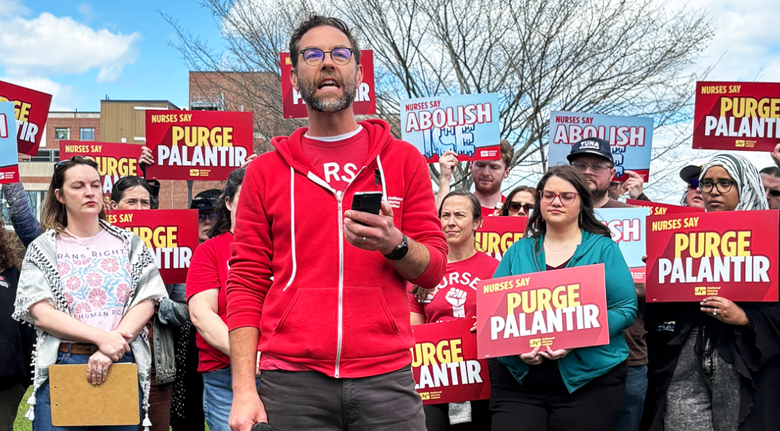 Maine nurses holding signs "Nurses say Purge Palantir" and "Nurses say Abolish ICE"