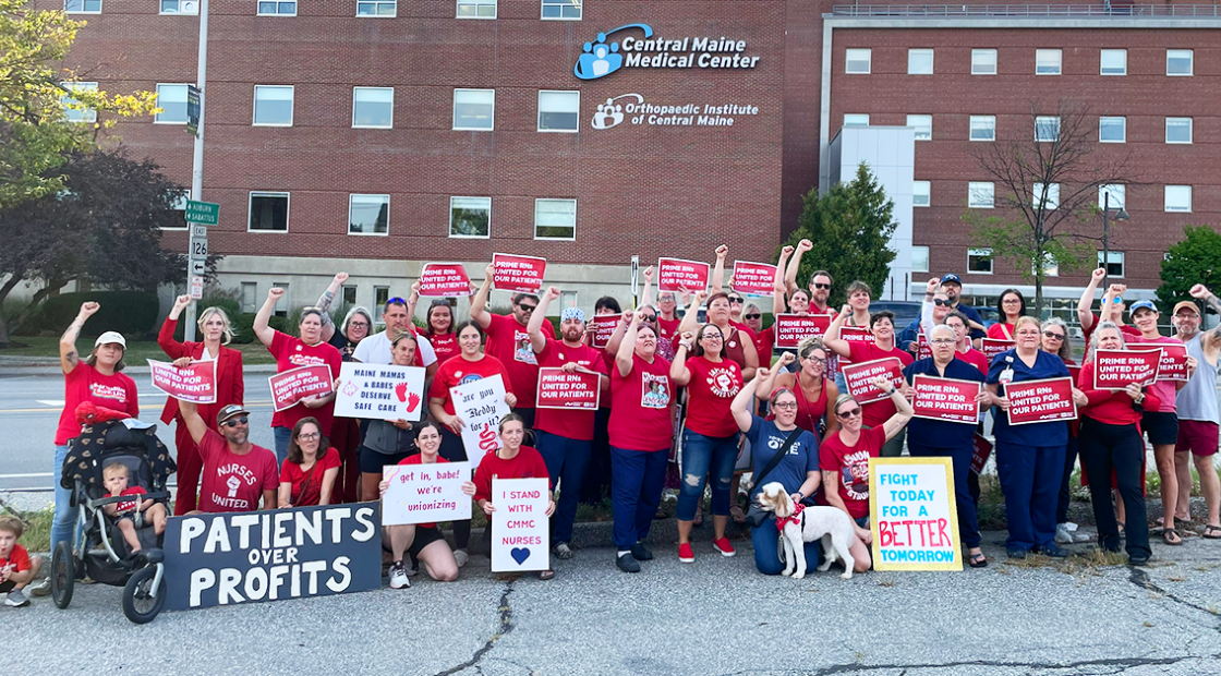 Cental Maine Medical Center nurses raising fists and holding signs "Prime RNs united for our patients."