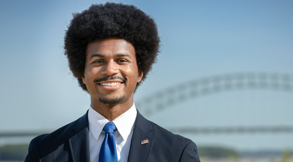 Justin Pearson outside, smiling