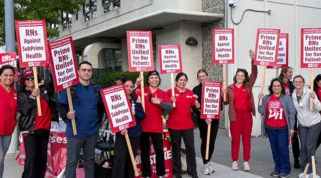 Nurses on strike line holding signs "Prime RNs United for our Patients"