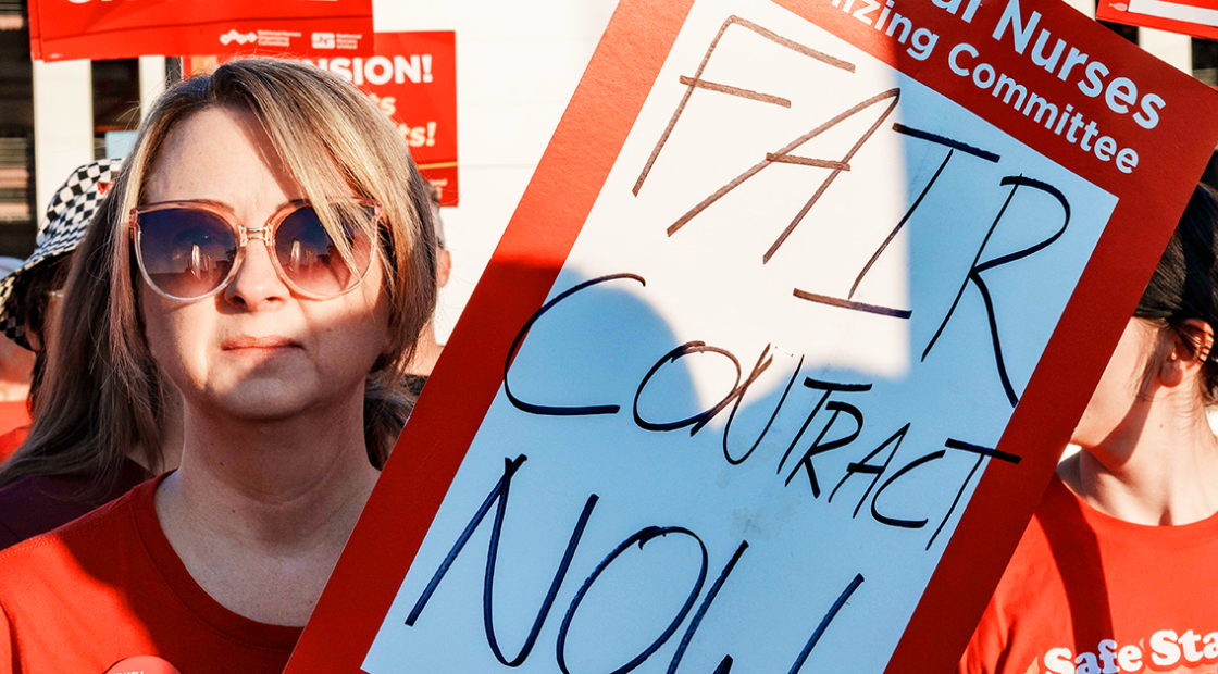 Wichita nurse holding sign "Fair contract now"