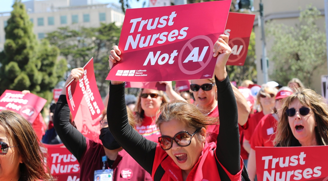 Nurses marching, holding signs "Trust Nurses Not A.I."