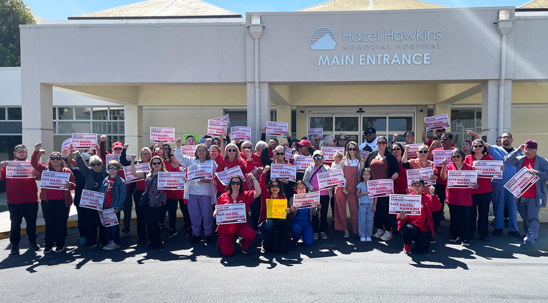Hazel Hawkins RNs and community holding signs in front of hospital to "Save our community hospital. Save Hazel Hawkins."