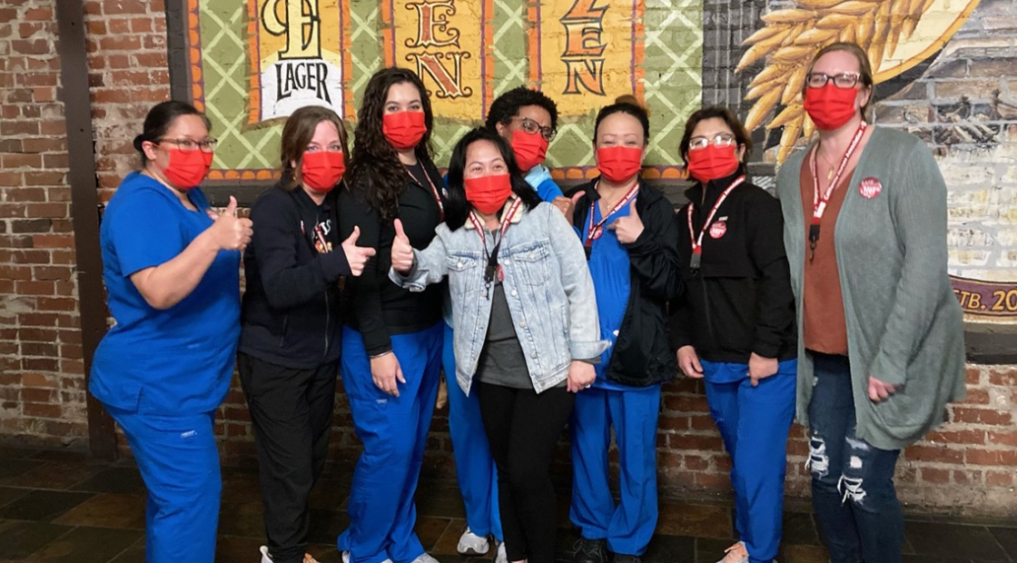 Group of nurses giving thumbs up
