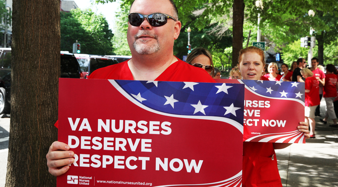 VA nurses marching with signs "VA nurses deserve respect now"
