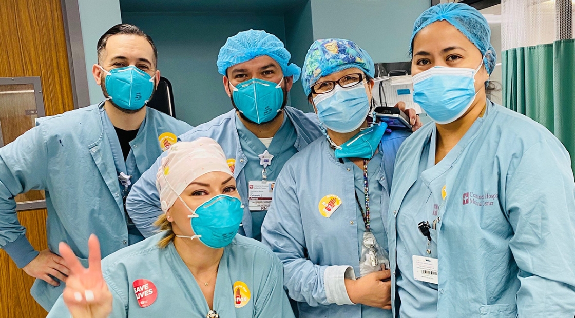 Group of five nurses inside hospital