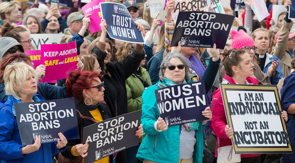 Large group of people holding Stop Abortion Bans Rally in St. Paul, Minnesota