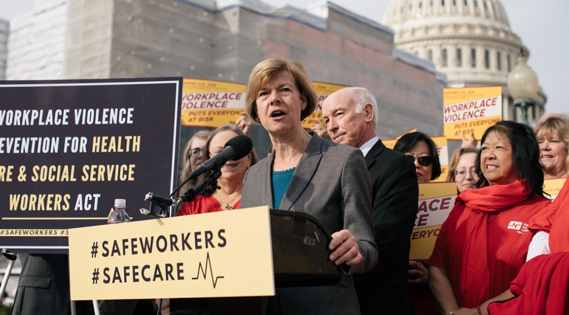 Senator Tammy Baldwin at podium outside Capitol Building