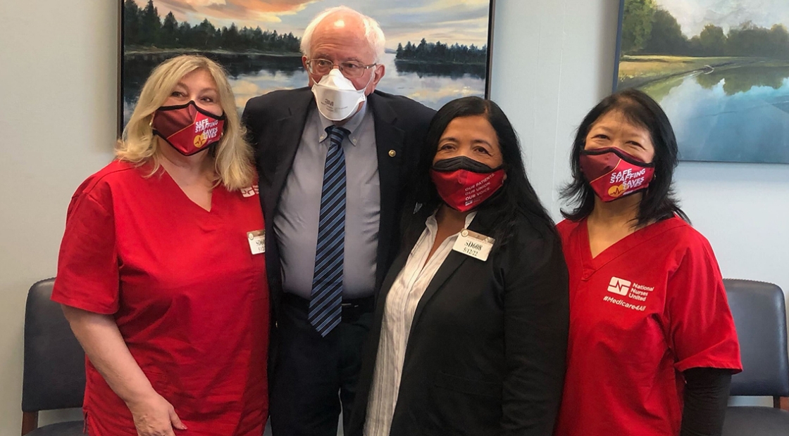 Group image of NNU President Jean Ross, RN; Senator Bernie Sanders; NNU Executive Director Bonnie Castillo, RN; and NNU President Zenei Triunfo-Cortez, RN