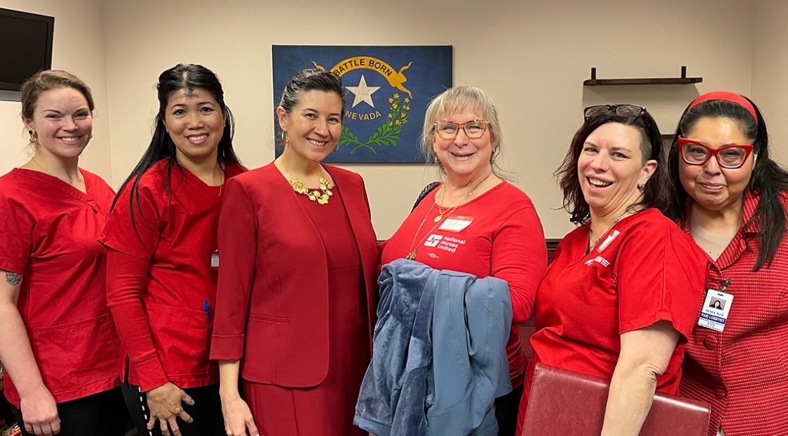 Five nurses standing, smiling with Nevada State Sen. Rochelle Nguyen