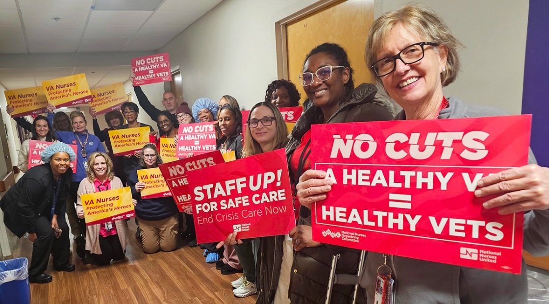 Nurses in hallway holding signs "No Cuts: A Healthy VA = Healthy Vets"