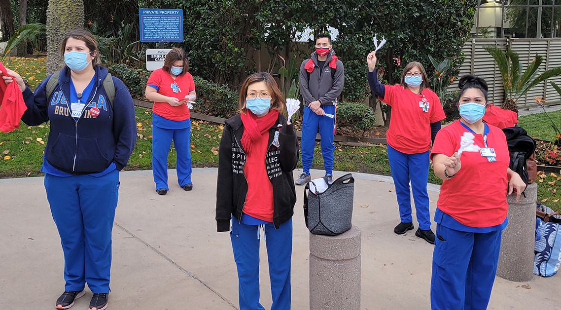 Group of nurses holding rally outside hospital 