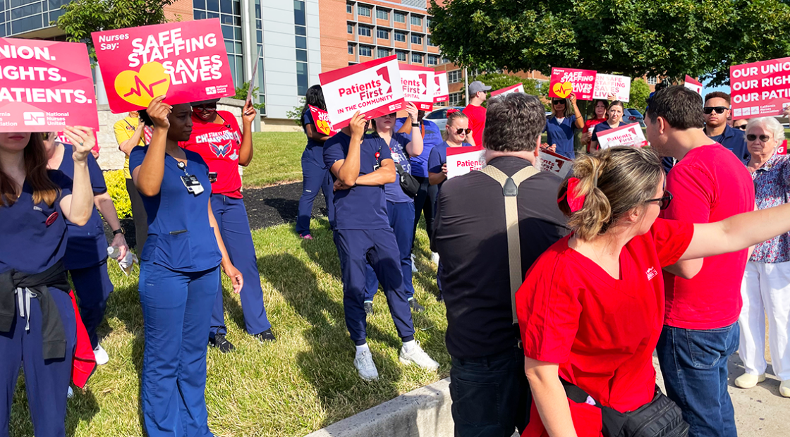 St. Agnes nurses holding signs "Our Union. Our Rights. Our Patients." "Safe Staffing saves lives" "Patients first in the hospital"