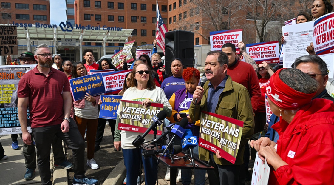 Health care workers and Congressman Chuy Garcia holding a press conference outside hospital