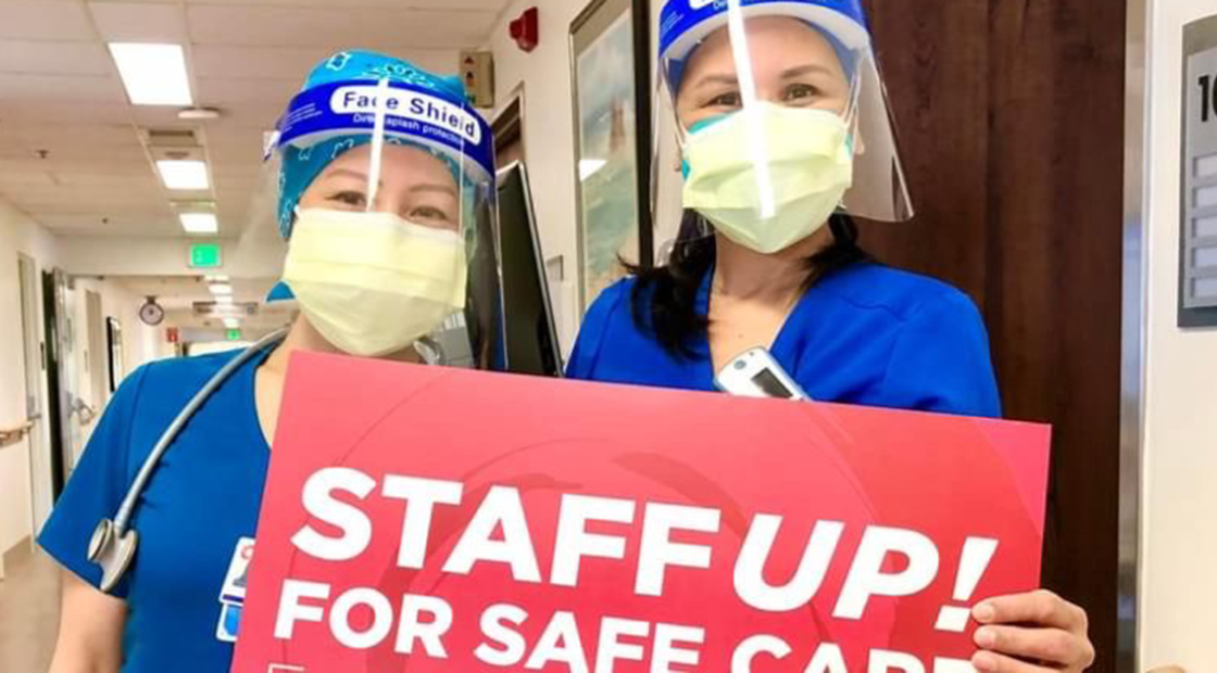 Two nurses holding sign: Staff up for safe care