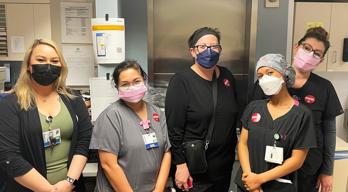 Group of five nurses inside hospital