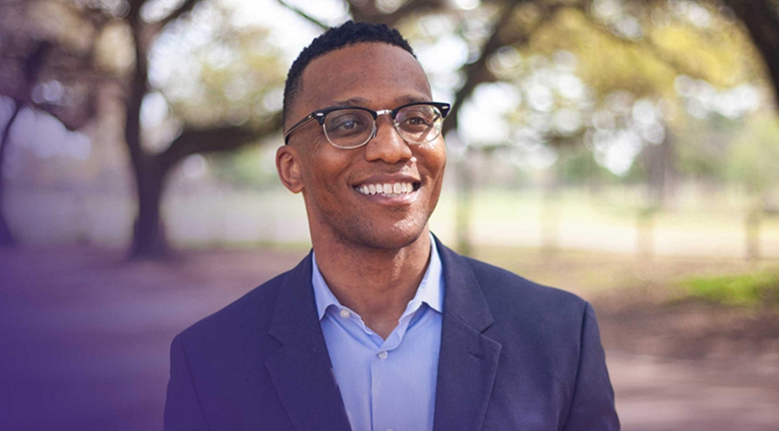 Congressional candidate Christian Menefee outside, smiling
