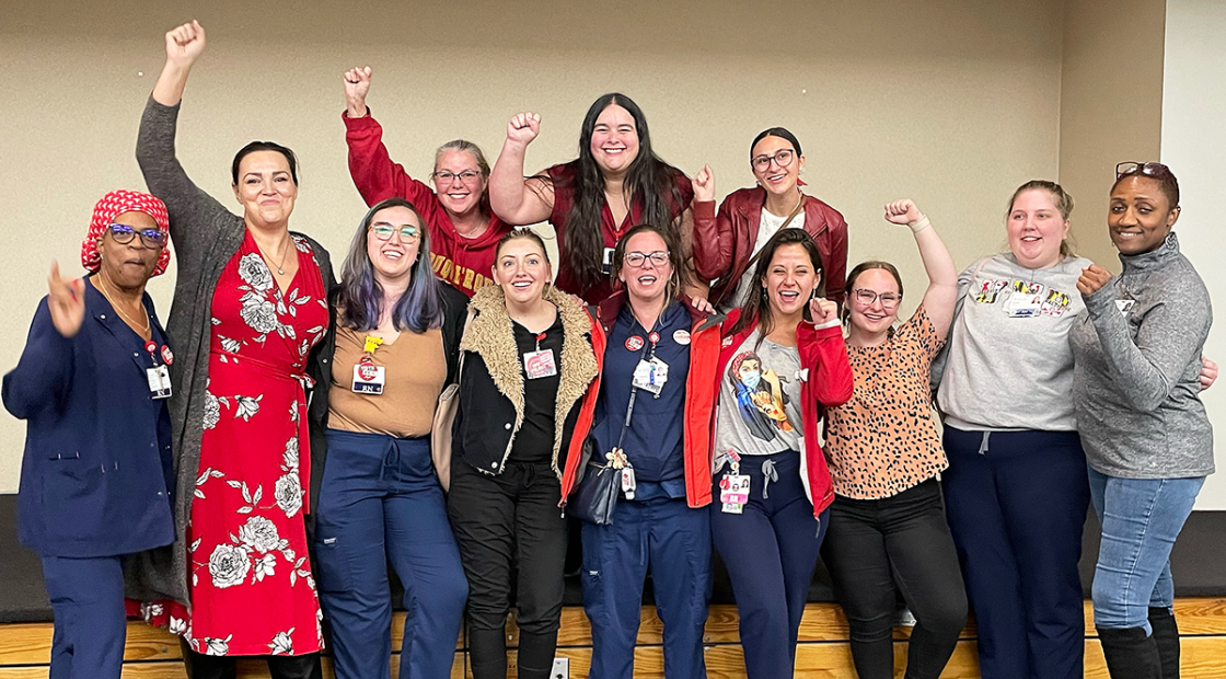 Joyous Saint Agnes nurses with fists raised