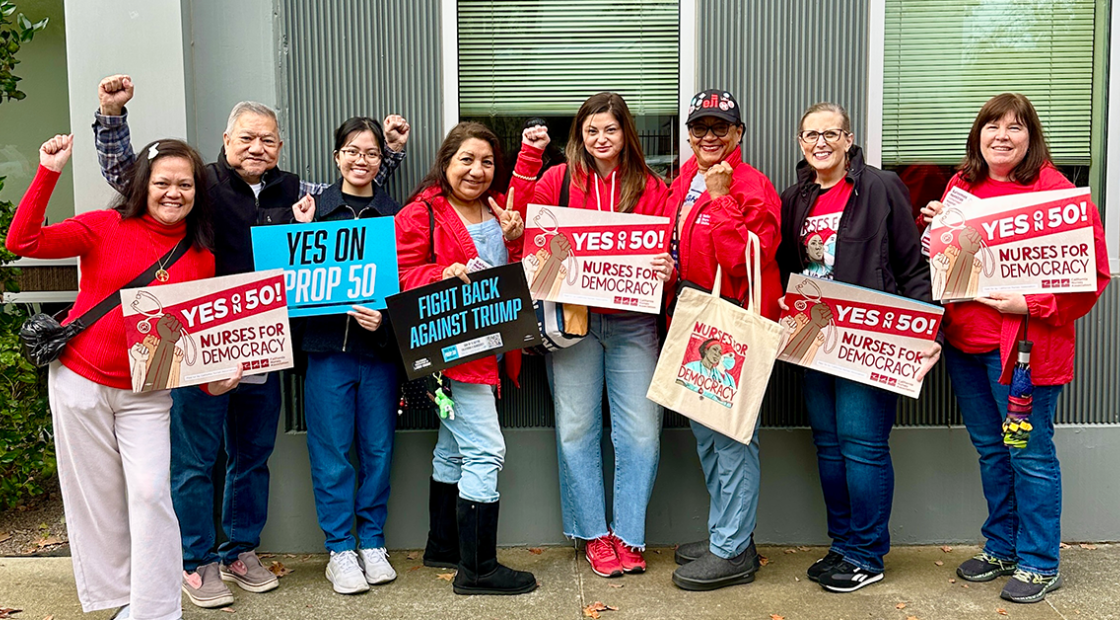 Nurses holding signs "Yes on 50: Nurses for Democracy"