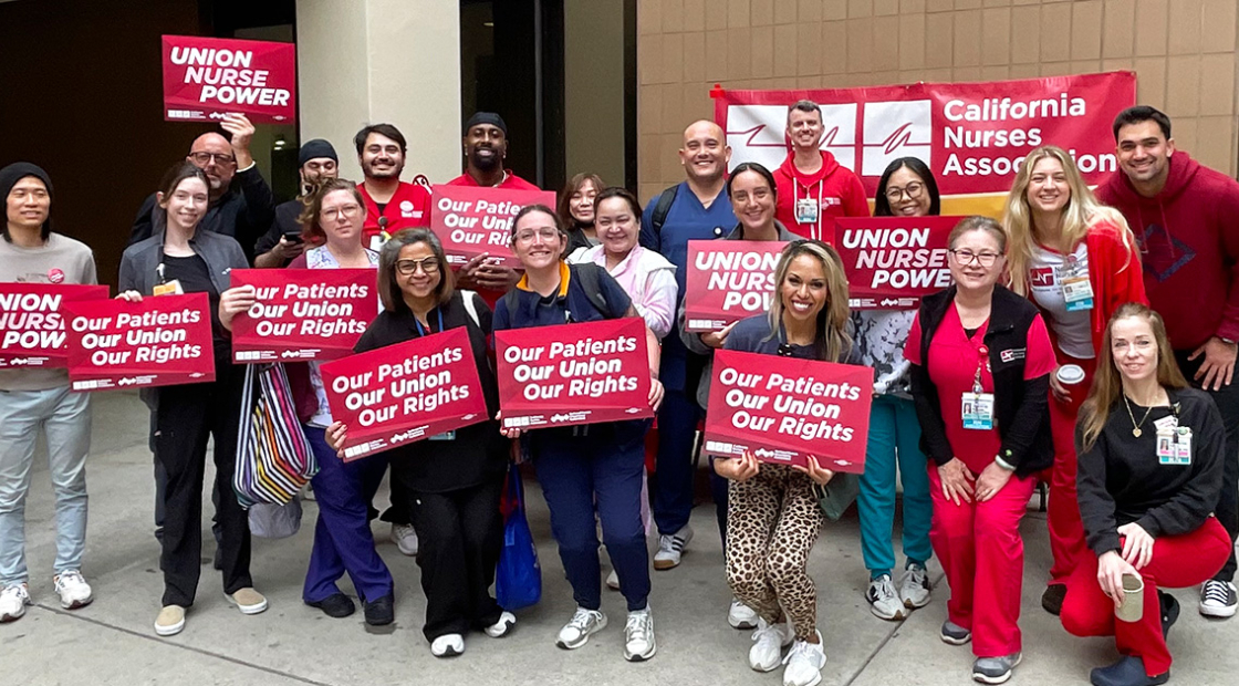 Group of nurses holding signs "Our Patients, Our Union, Our Rights"