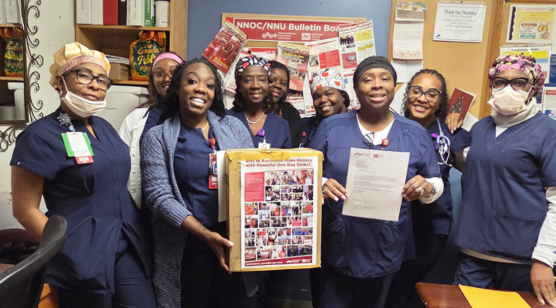 Nurses inside hospital holding letter
