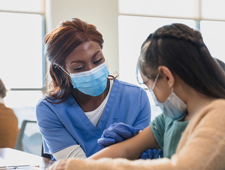 Nurse administering vaccination