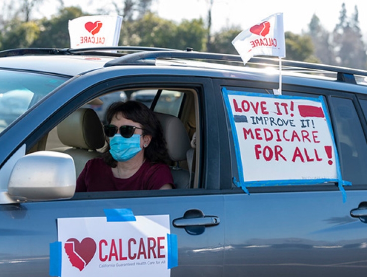 Person in CalCare car caravan