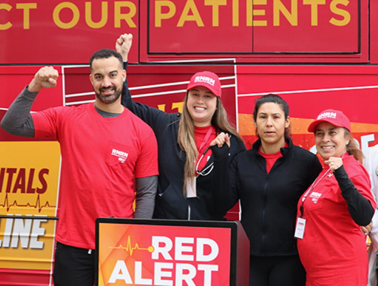Nurses in front of Red Alert tour bus