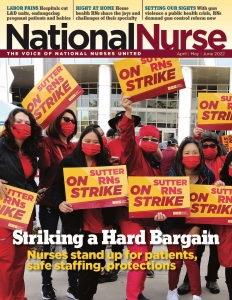 Group of nurses outside hold signs "Sutter RNs On Strike" 