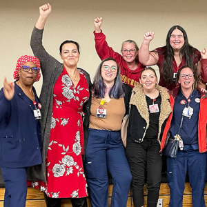 Joyous Saint Agnes nurses with fists raised