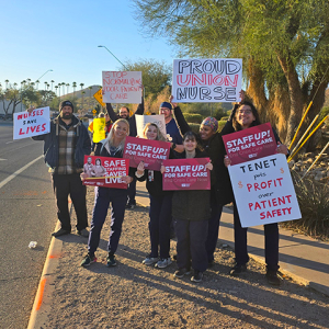 Nures picketing outside, holding signs calling for safe staffing