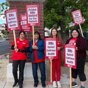 Nurses holding picket signs "Prime RNs United for our Patients"